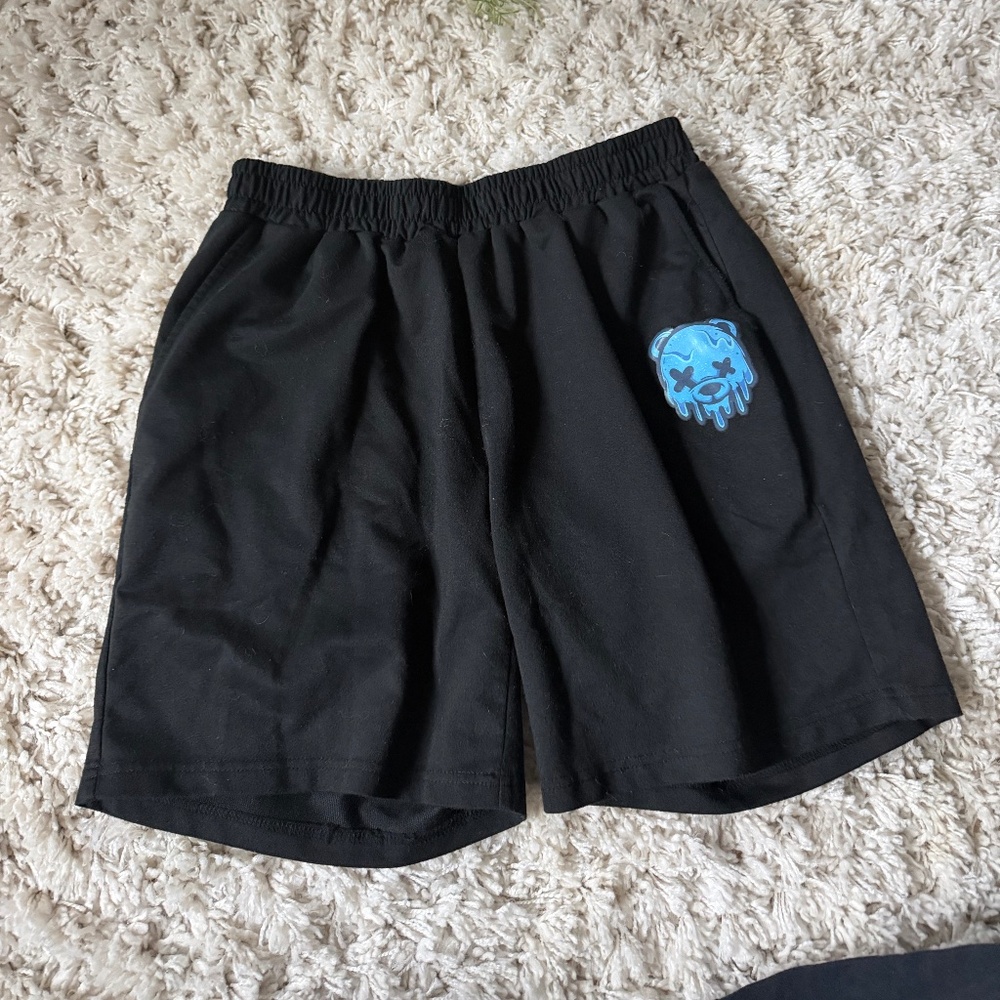 Upgrade your workout gear with these black athletic shorts featuring a striking